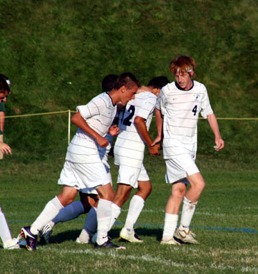 St. Thomas players congratualte Jon Diietro on his first varsity goal
